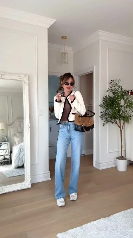 Cream H&M jacket with brown top, light-wash wide-leg jeans, white and silver sneakers and tan-and-black shoulder bag