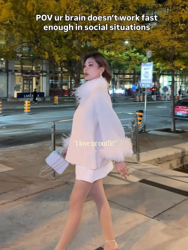 Kerina in a white feather coat outfit